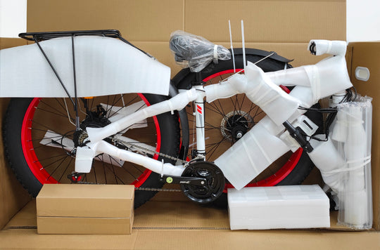 Photo of Senada VIPER Softail Electric Mountain Bike, red and black, in box and unboxed with foam protectors